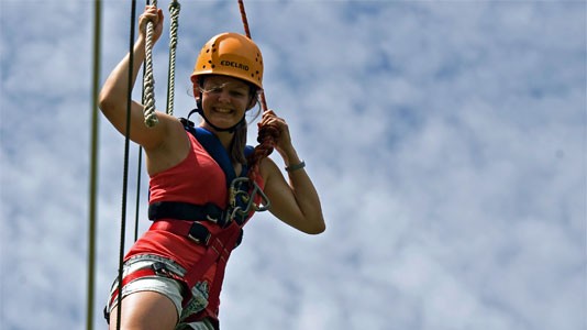 Girl up really high looking proud of her achievcements